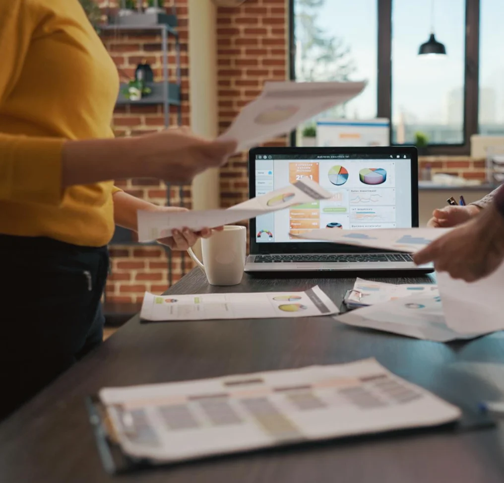 Digital marketers reviewing reports